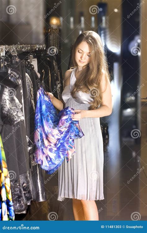 Rich Woman Chooses A Dress In A Boutique Stock Photos - Image: 11481303