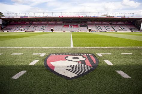 Download AFC Bournemouth Logo On The Field Wallpaper | Wallpapers.com