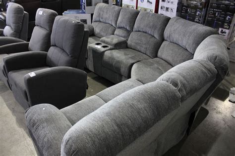 GREY CURVED SECTIONAL SOFA WITH CONSOLE AND CUP HOLDERS - Able Auctions