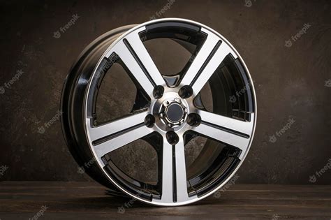 Premium Photo | New black alloy wheels on a dark textured black ...