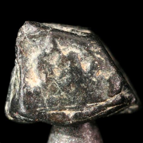 Thorianite, a sample of the element Thorium in the Periodic Table