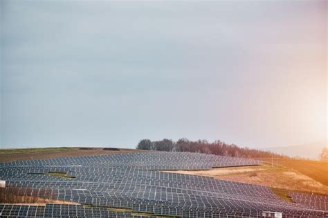 Premium Photo | Solar power plant with rows of sleek blue photovoltaic ...