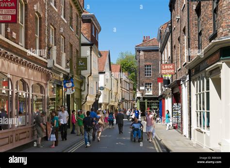 Shops on Low Petergate in the City Centre, York, North Yorkshire, England Stock Photo - Alamy