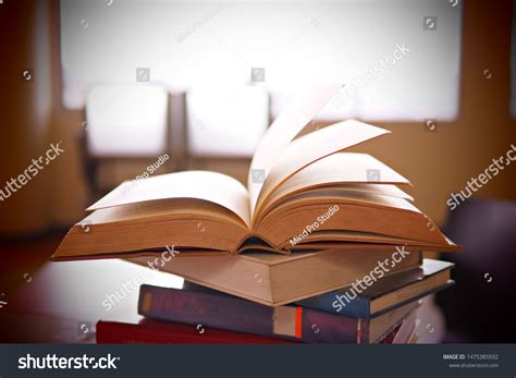 Books on study desk in a library, education or academic concept picture of learning materials ...