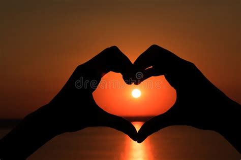 Silhouette of Hands in Form of Heart on Background of Sunset Stock Photo - Image of background ...