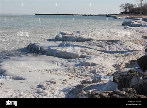 The frozen shoreline of Lake Michigan on a sunny winter day Stock Photo ...