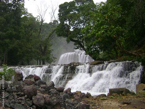 Side view of the Tinuy-an Falls cascading into the river. Tinuy-an Falls is popularly known as ...