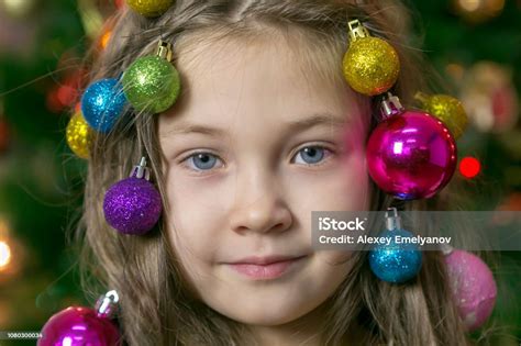 Girl With Christmas Decorations In Her Hair Stock Photo - Download ...