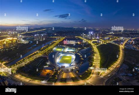 Jiangmen city skyline binjiang district sports center of night Stock Photo - Alamy