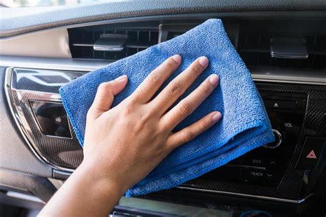 Hand with microfiber cloth cleaning Interior modern car. 10388140 Stock Photo at Vecteezy