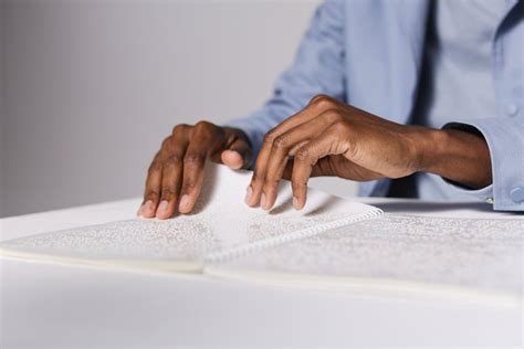 Blind Person Reading a Braille Book · Free Stock Photo