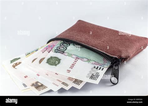 Russian Ruble banknotes in brown wallet isolated Stock Photo - Alamy