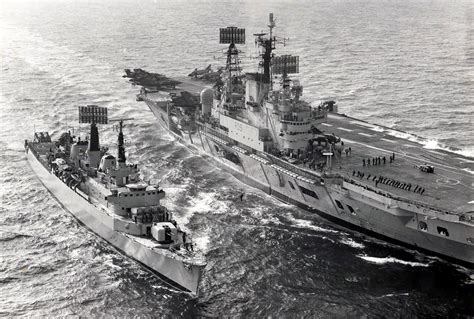 Audacious class aircraft carrier HMS Ark Royal (R09) and County class destroyer HMS Antrim (D18 ...