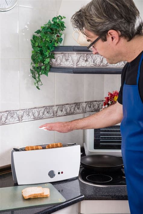 Toasting bread stock photo. Image of kitchen, bread, househusban - 72215702