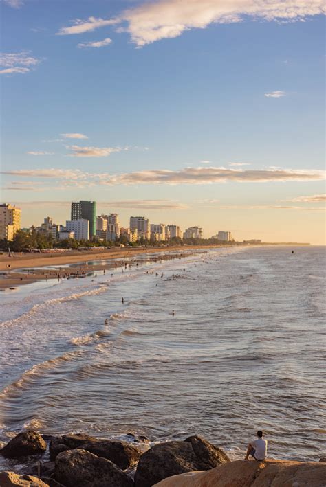 Browse Free HD Images of Busy Beach With City Buildings Surrounding The Coastline