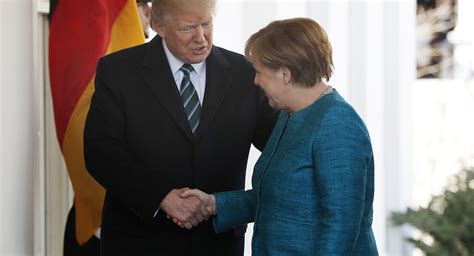 In awkward exchange, Trump seems to ignore Merkel's handshake request ...