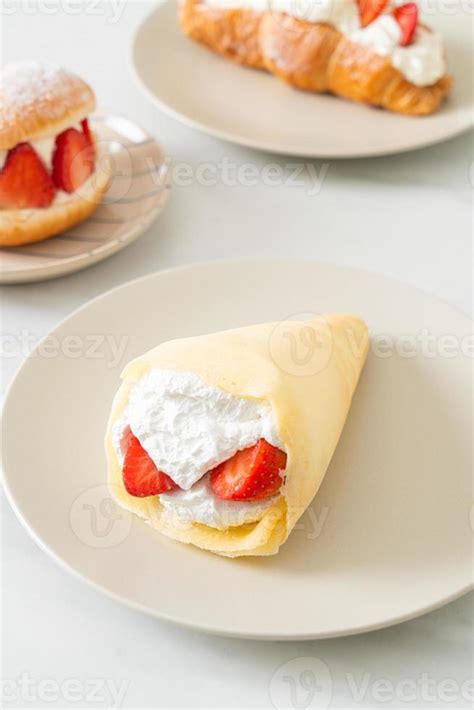 fresh strawberry cream crepe on plate 5295969 Stock Photo at Vecteezy