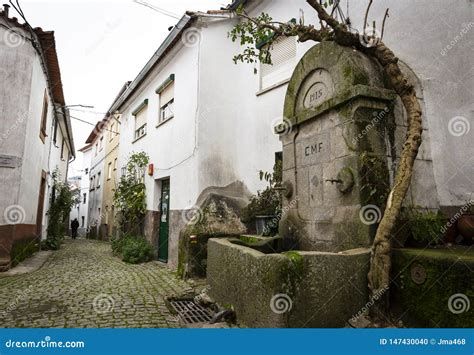 A Cobbled Street with an Antique Water Fountain in Barroca Village Stock Photo - Image of house ...