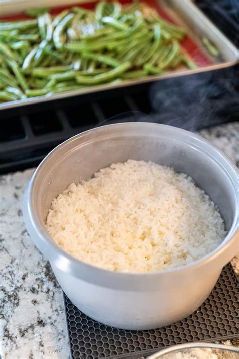 Calrose Rice Delight: Effortless Cooking in a Rice Cooker Stock Image - Image of preparing, rice ...