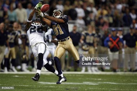 St, Louis Rams Torry Holt in action, making catch and scoring... News ...