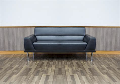 Black leather sofa in the living room 16561476 Stock Photo at Vecteezy