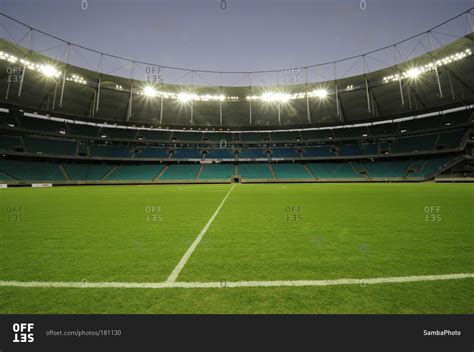 Empty soccer field at dusk stock photo - OFFSET