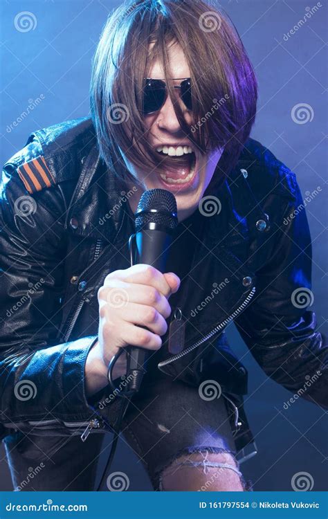 Young Guy Singing Rock Music Stock Photo - Image of expression ...