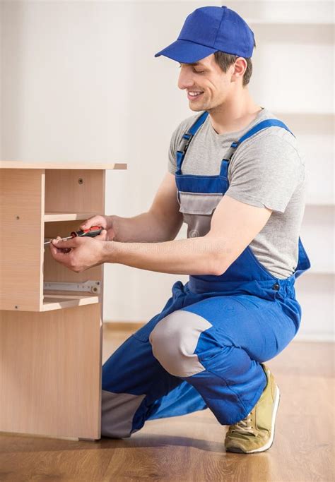 Man Putting Together Self Assembly Furniture in New Home Stock Photo - Image of making ...