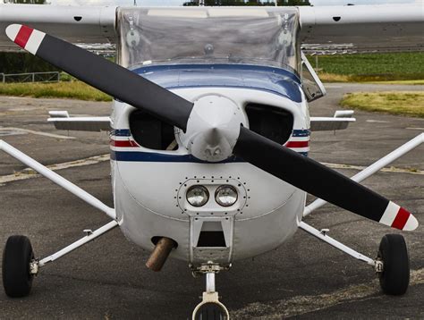 Symmetrical front view of Cessna 172 Skyhawk 2 airplane on an asphalt ...