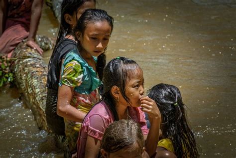 Laos - Children playing in the water.