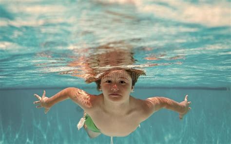 Underwater Child in the Swimming Pool. Cute Kid Boy Swimming in Pool Under Water. Stock Image ...