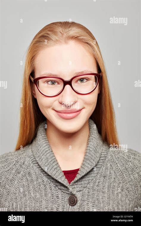 Head shot of a young blond woman wearing glasses for a job application Stock Photo - Alamy