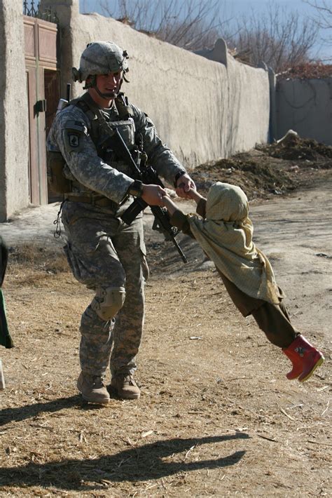 15 War Zone Photographs That Show Even Soldiers Have A Heart