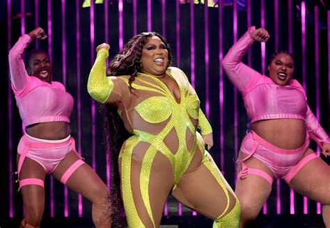 Lizzo Wears Neon Bedazzled Catsuit on Special Tour | POPSUGAR Fashion