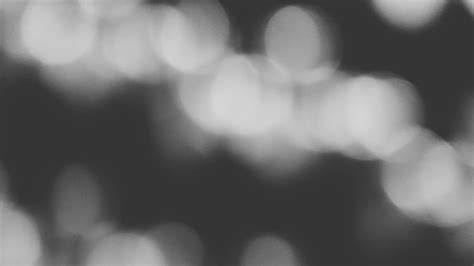 Blurred white Bokeh of light on black background in monochrome or black ...