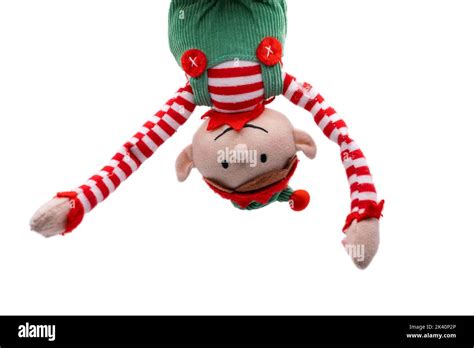 Elf on a Shelf hanging upside down isolated on whiote background Stock Photo - Alamy