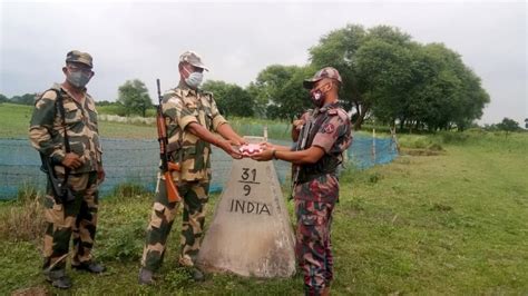 India-Bangladesh border force mark Eid-al-Adha by exchanging sweets and greetings | Latest News ...