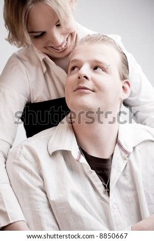 Studio Portrait Of A Young Amorous Couple Making Eye Contact With Eachother Stock Photo 8850667 ...