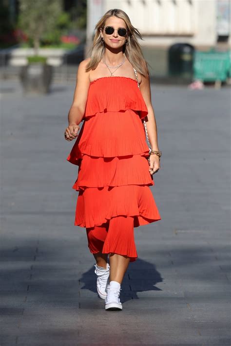 Vogue Williams - In orange dress at the Heart Radio Studios in London ...