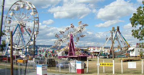 an amusement park with ferris wheels and other rides