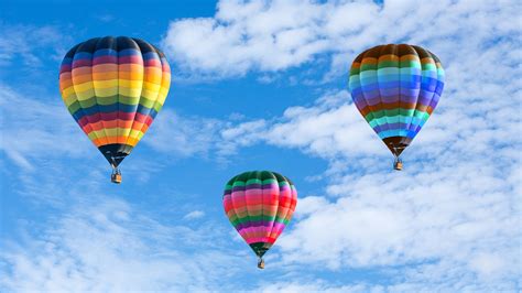 Colorful hot air balloons on the blue sky - Wonders & Holidays