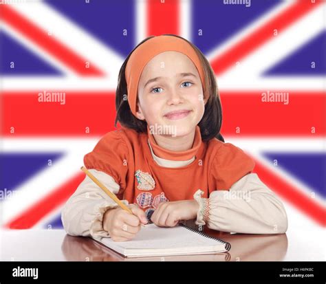 Cute Happy Girl Studying In Front Of British Flag Stock Photo - Alamy