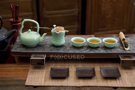 Traditional chinese tea set on tray in tea room — green tea ...