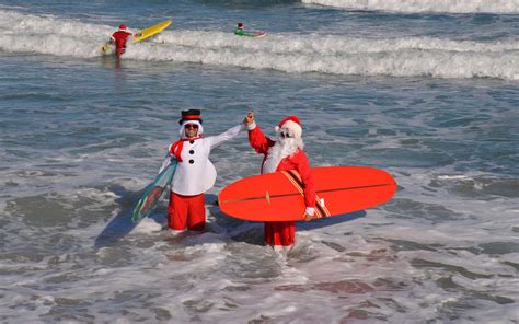 Celebrate Christmas Eve With Hundreds of Surfing Santas on Cocoa Beach | Travel + Leisure