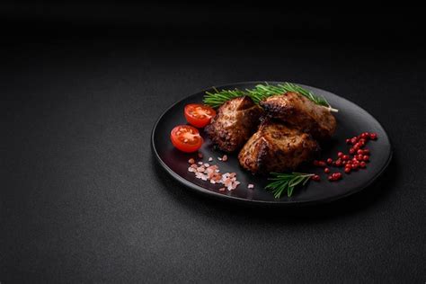 Premium Photo | Delicious grilled meat in the form of a kebab with ...