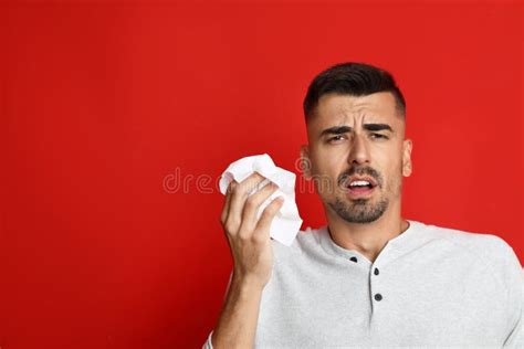 Man Sneezing on Background, Space for Text. Cold Symptoms Stock Photo ...