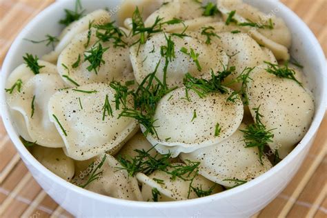 Pelmeni - traditional russian dish. — Stock Photo © OlegDoroshenko #11399659