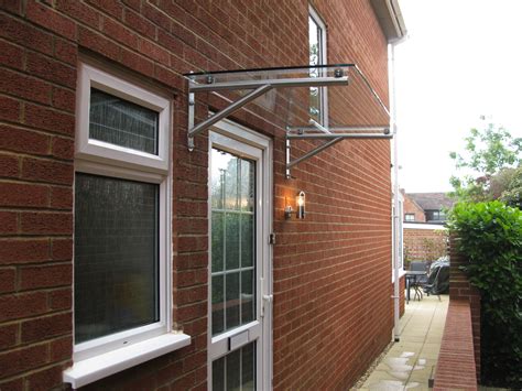 Modern glass door canopy. Hand made in North Yorkshire UK | Luifel