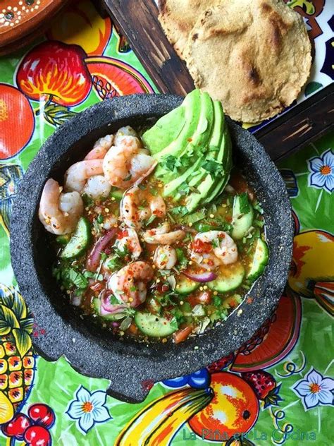 Top view of chile piquin shrimp aguachile in the Mexican molcajete, Two ...