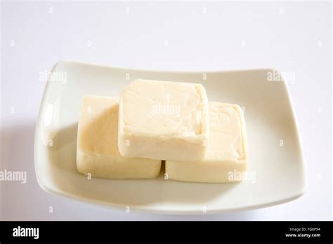 Cheese pressed into firm or hard mass home or dairy product Stock Photo - Alamy